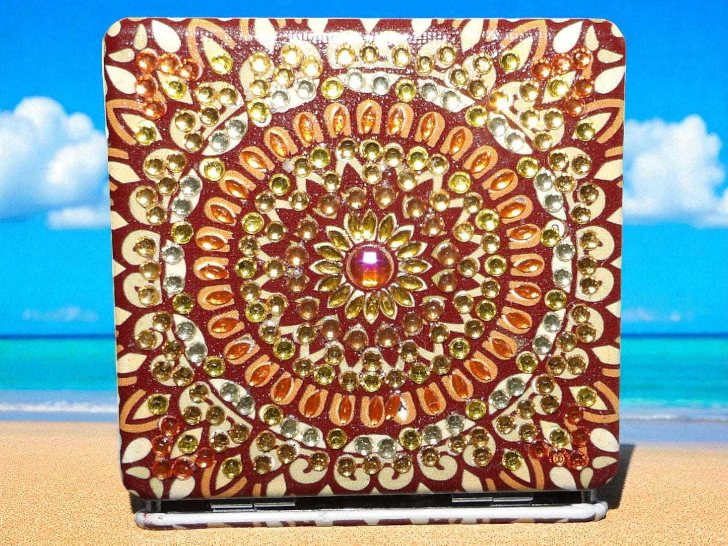 Brown square pocket mirror with mandala design and magnification feature