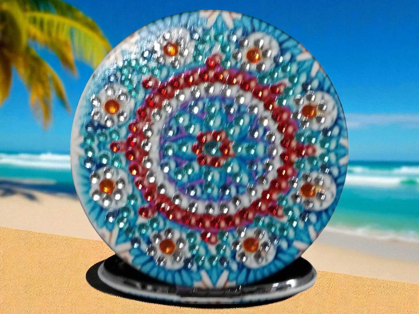 Blue round pocket mirror with mandala design and magnification on one side