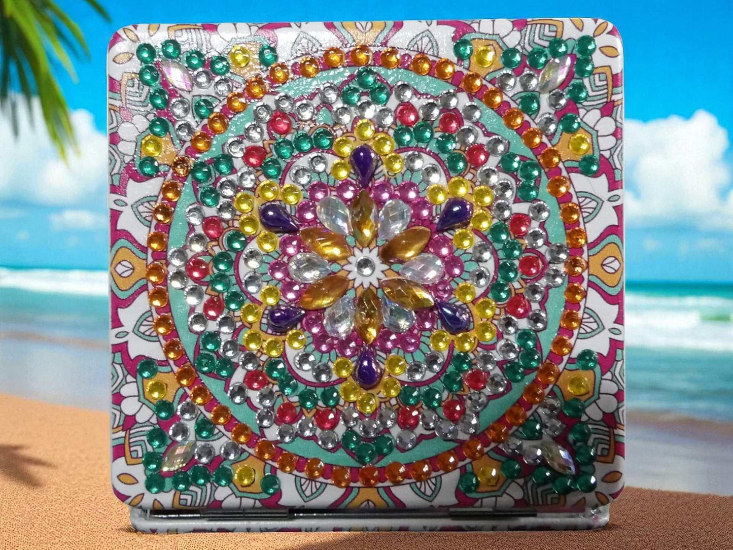 Greenish square pocket mirror with colorful mandala design and decorative gems