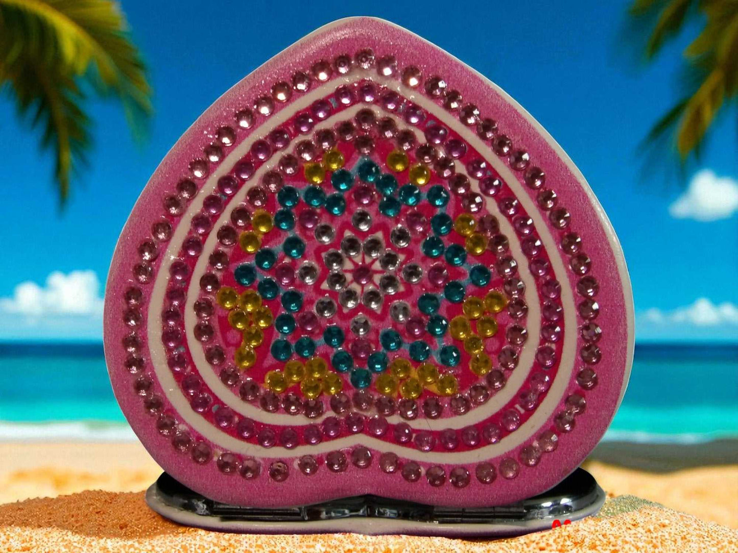 Blue Star Heart mandala design pocket mirror with magnification and regular side on beach background