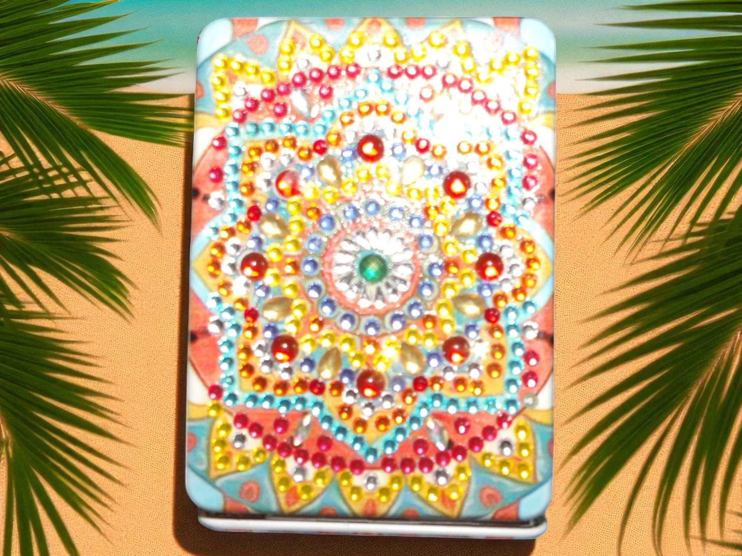 Colorful rectangle pocket mirror with vibrant mandala design and magnification feature on one side