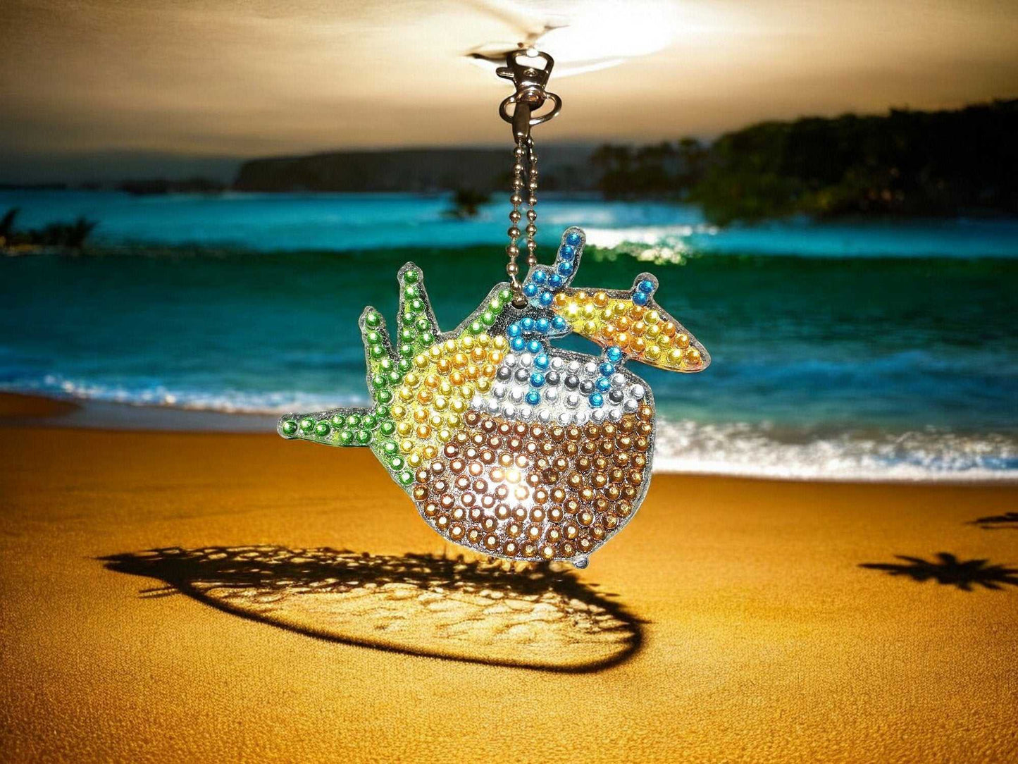 Summer Drink w/Umbrella keychain hanging with beach background and sparkling beads design