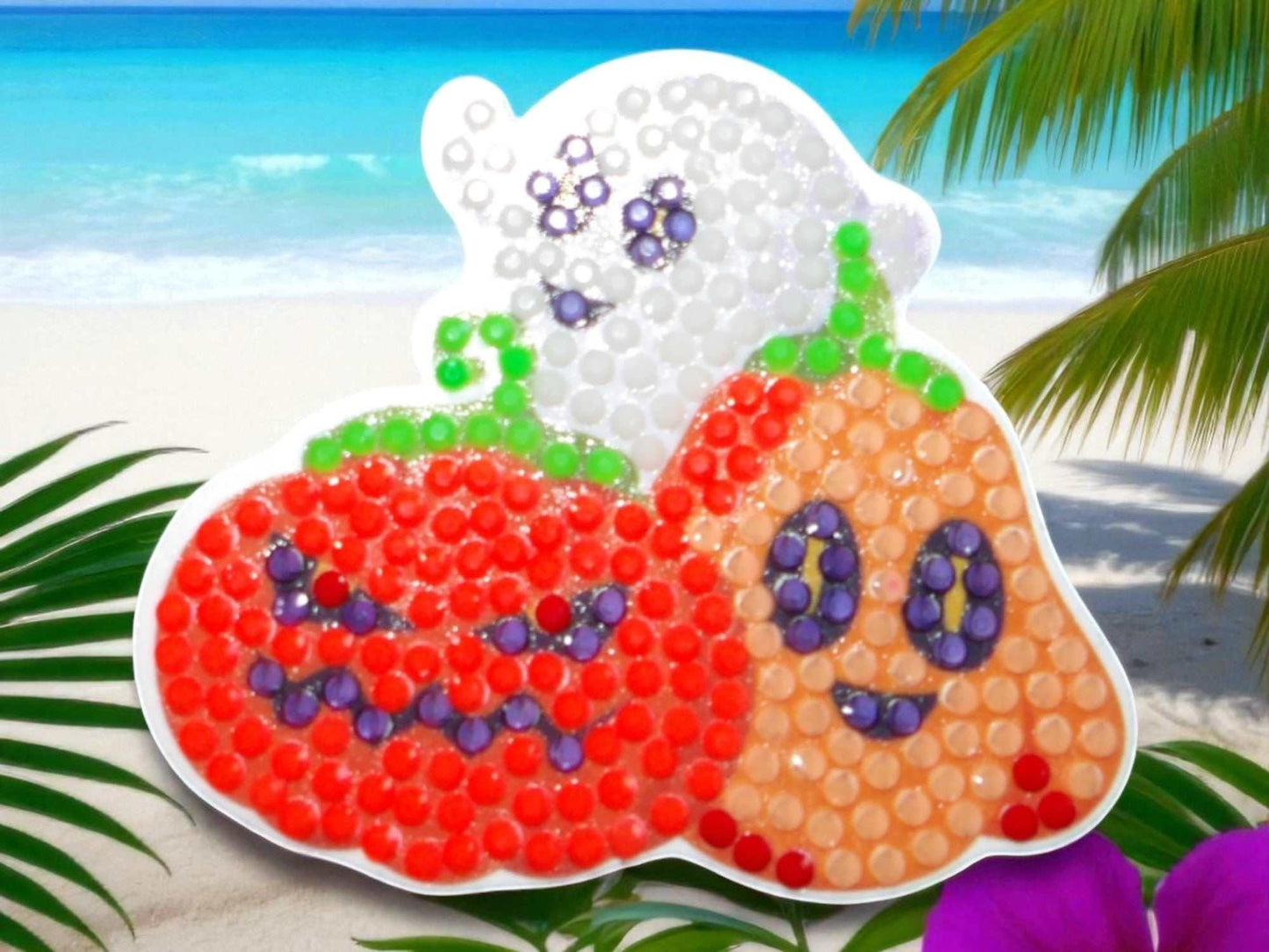 Glow in the dark Halloween family magnet with ghost and pumpkins design on beach background