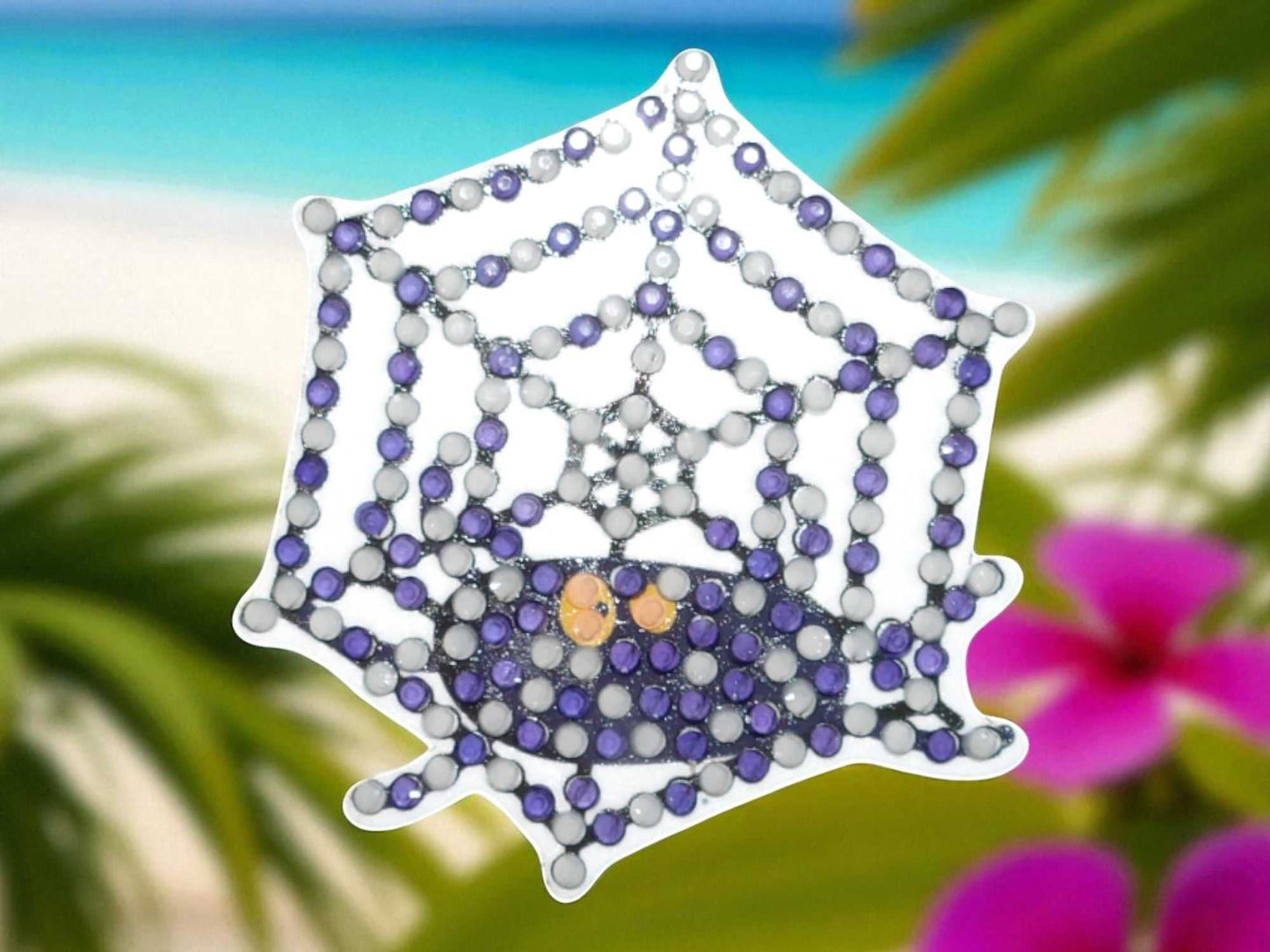 Glow in the dark spider on spider web magnet with purple and white beads