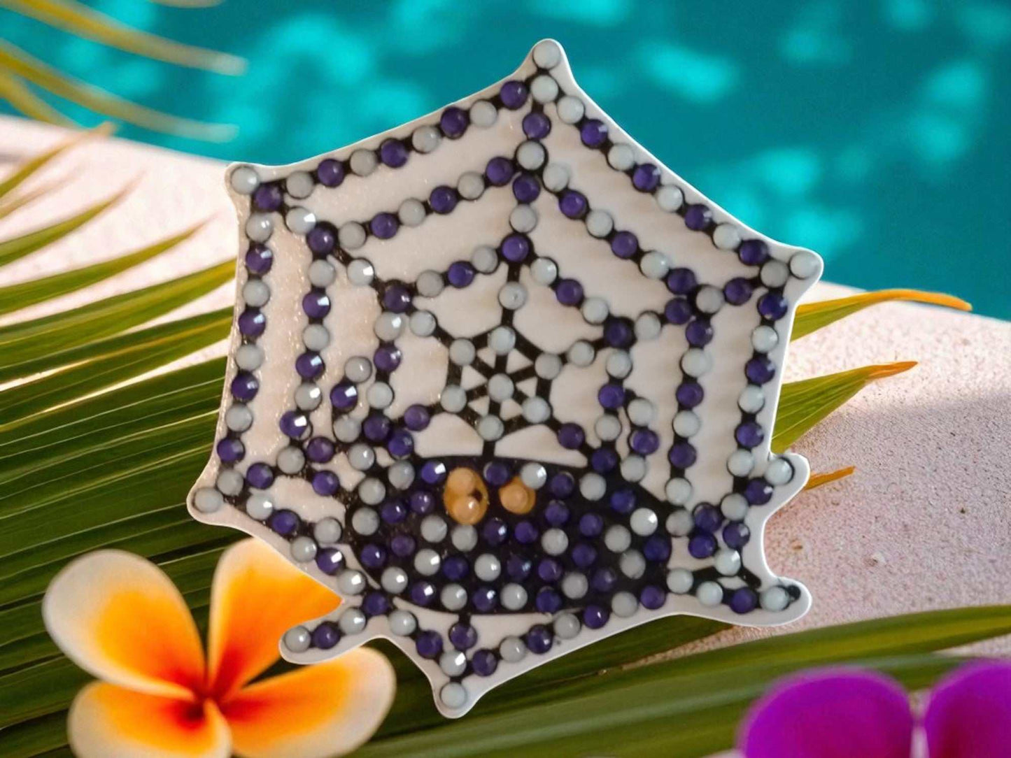Glow in the dark spider on spider web magnet with colorful dots design