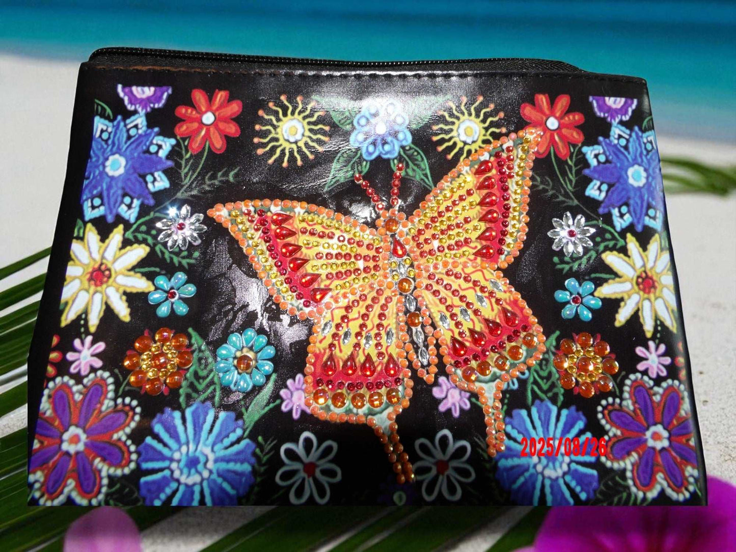 Golden Butterfly Large Hand Clutch with jeweled butterfly and colorful floral design on black background