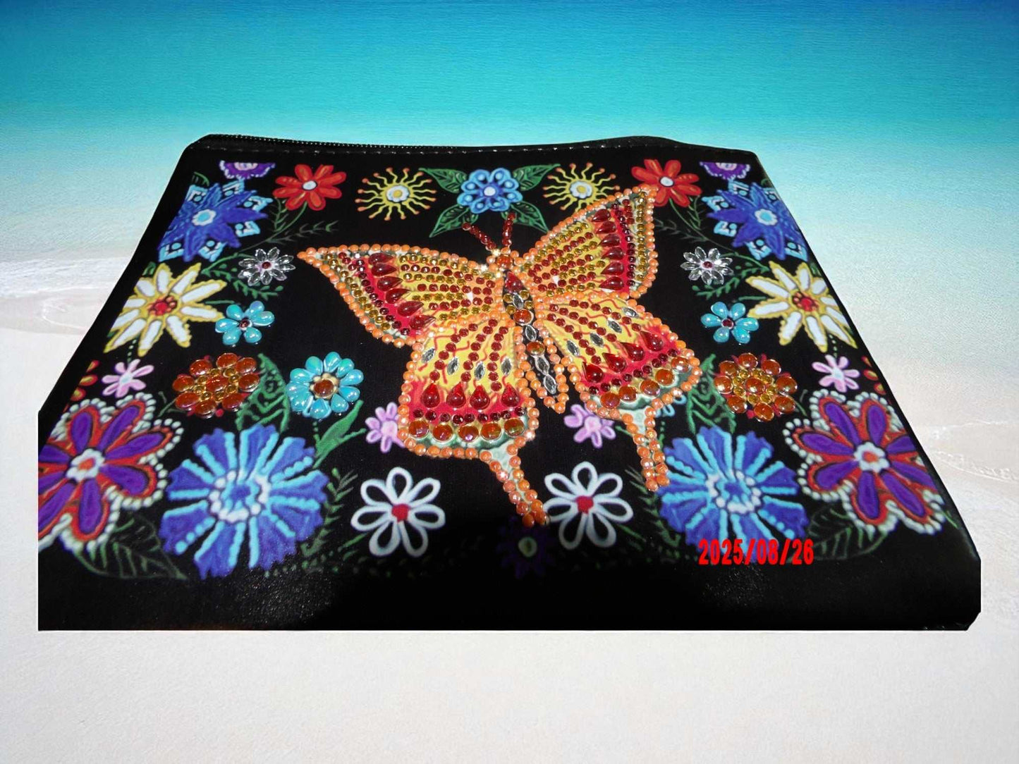 Golden Butterfly Large Hand Clutch with colorful embroidered floral design and sparkling butterfly embellishment on black background
