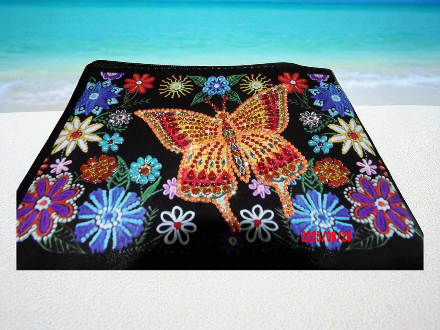 Golden Butterfly Large Hand Clutch with colorful embroidered flowers and beaded butterfly detail on black background