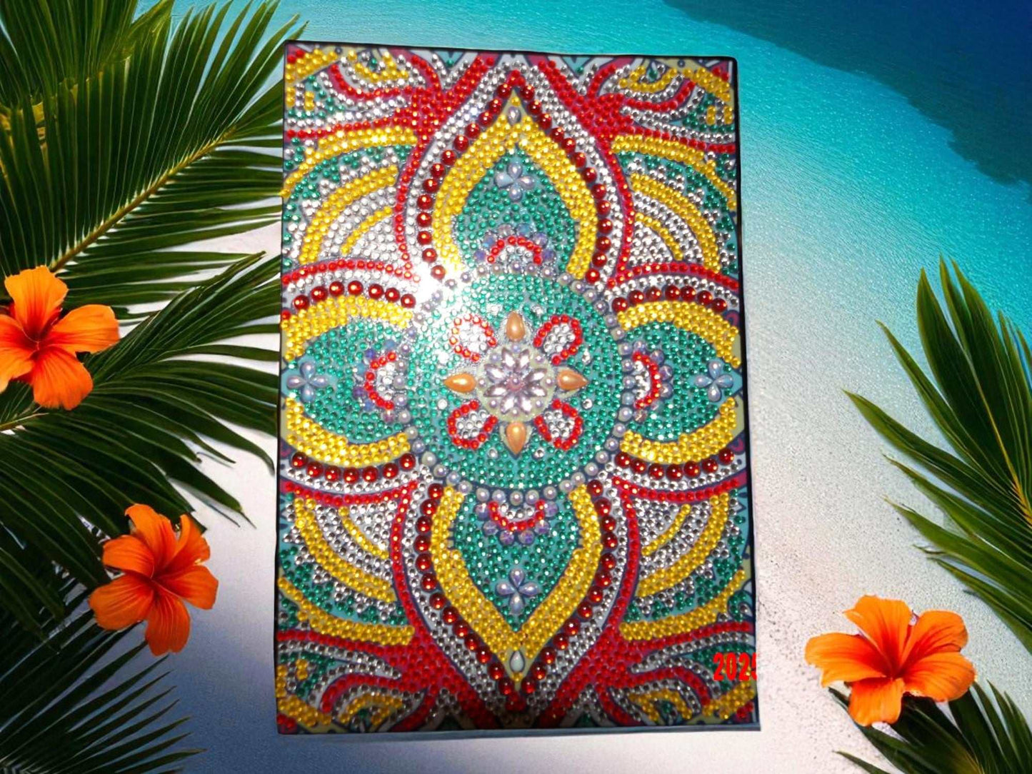 Beautiful colorful design journal with intricate beaded floral pattern on the cover