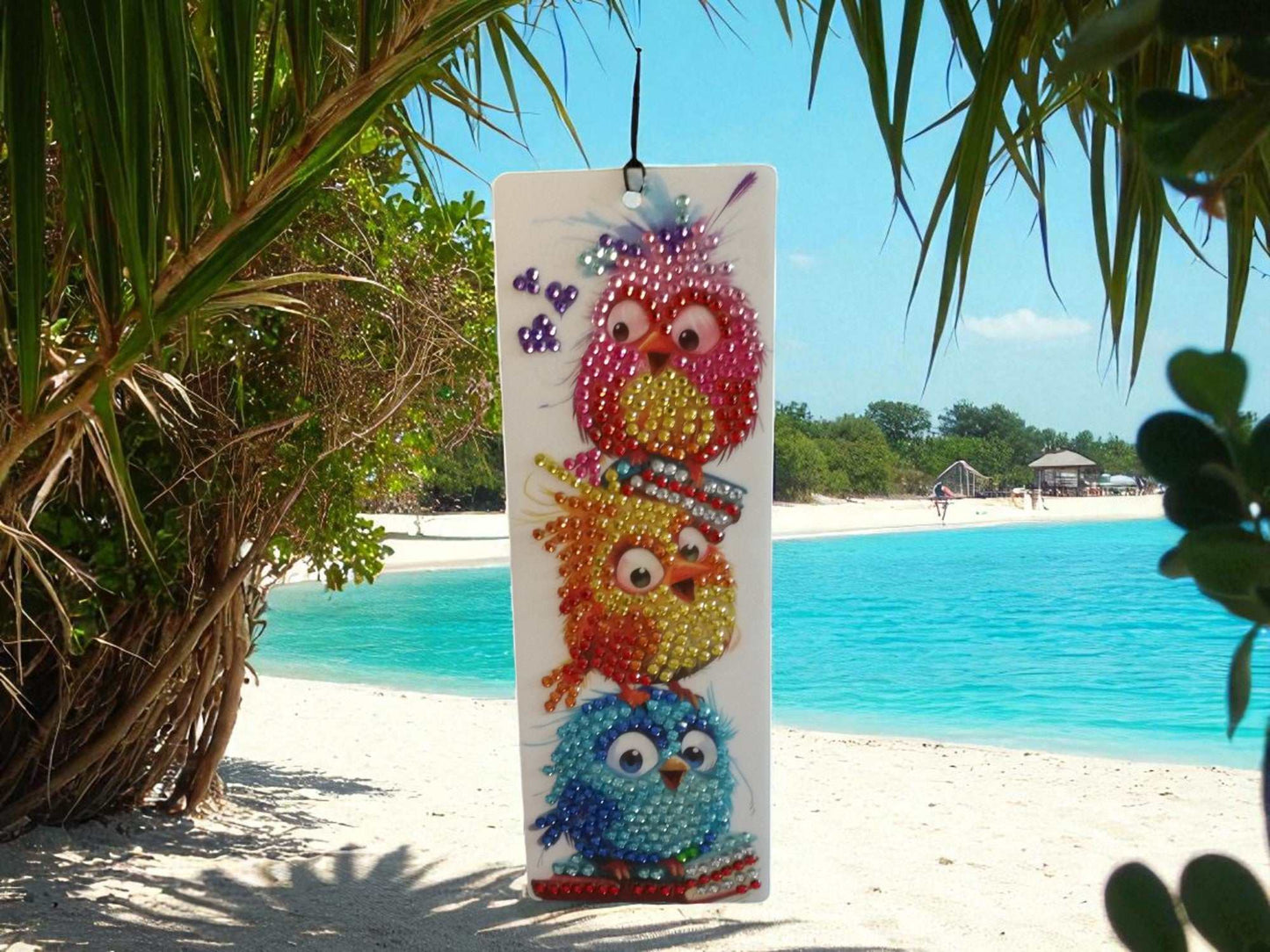 Surprised colorful birds bookmark with vibrant, wide-eyed birds on beach background