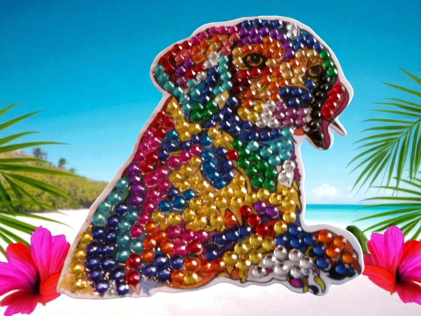 Colorful dog magnet with vibrant rhinestone design on tropical beach background
