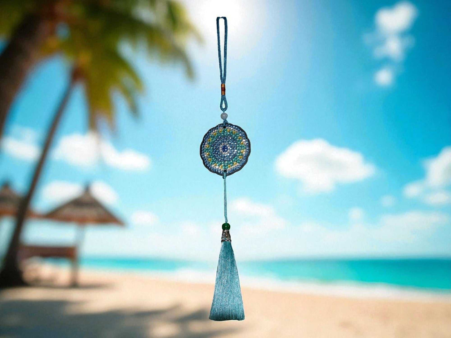 Sky blue colorful car ornament hanging with beach background