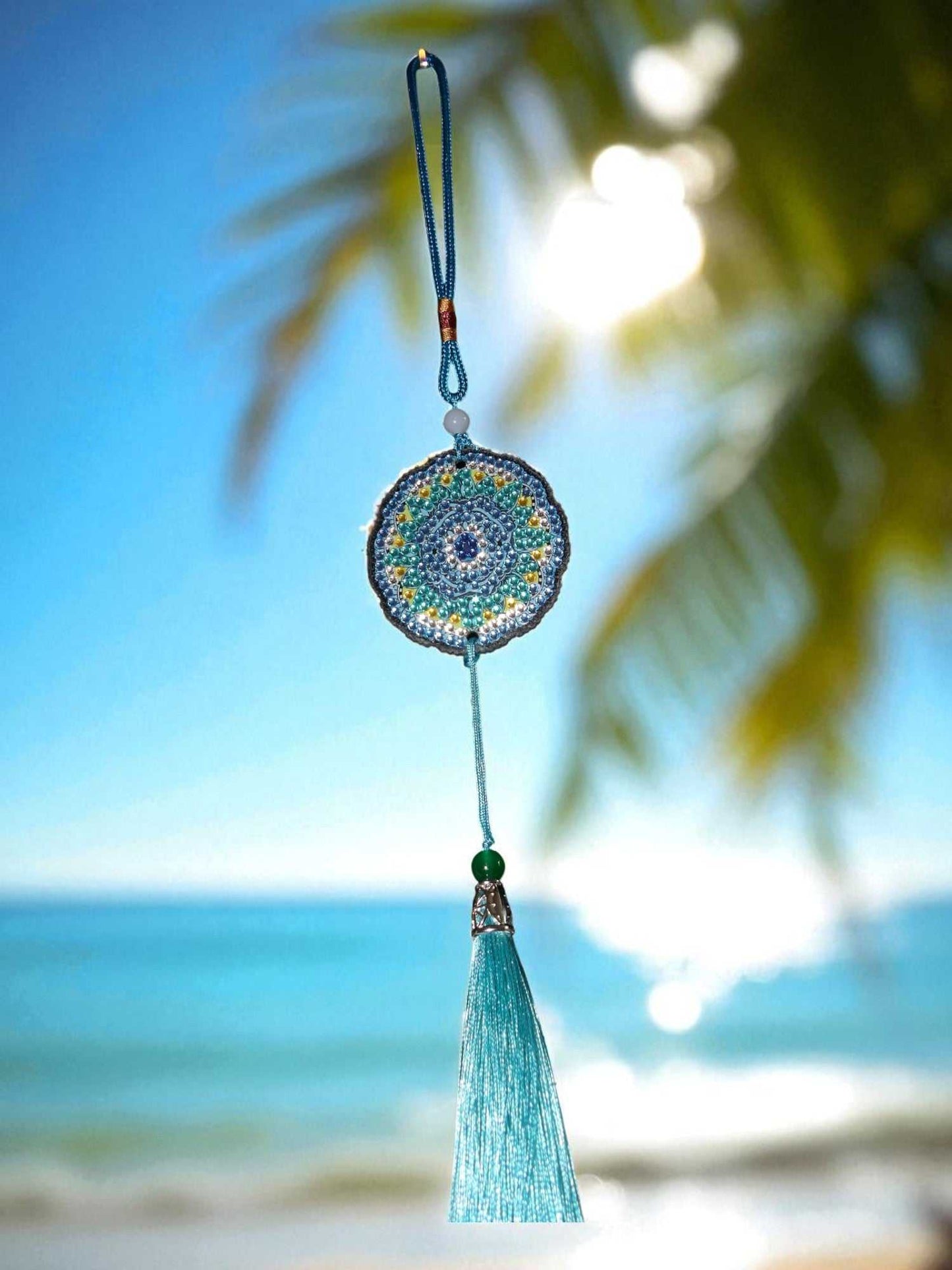 Sky blue colorful car ornament hanging with beach background