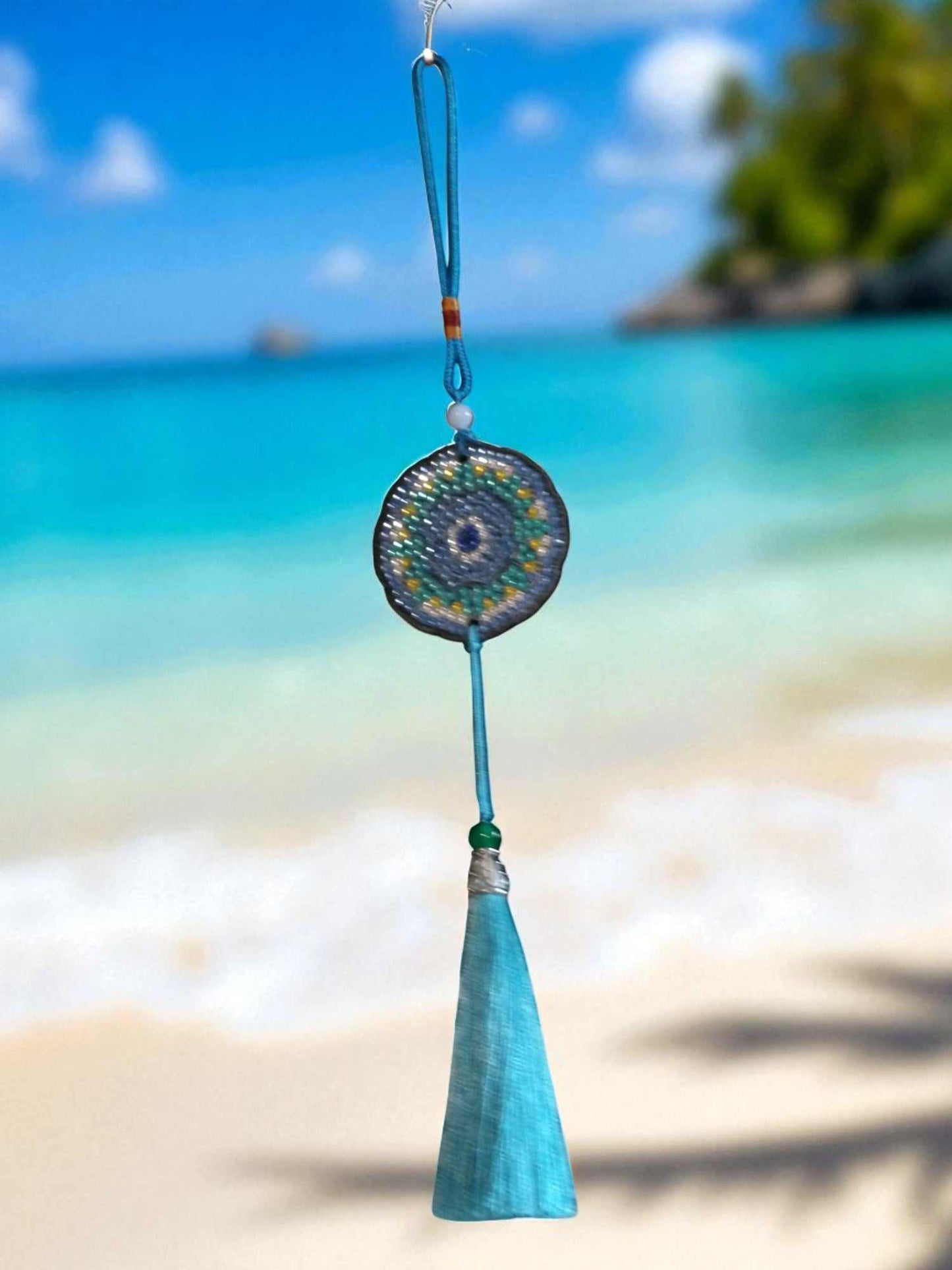 Sky blue colorful car ornament hanging with beach background