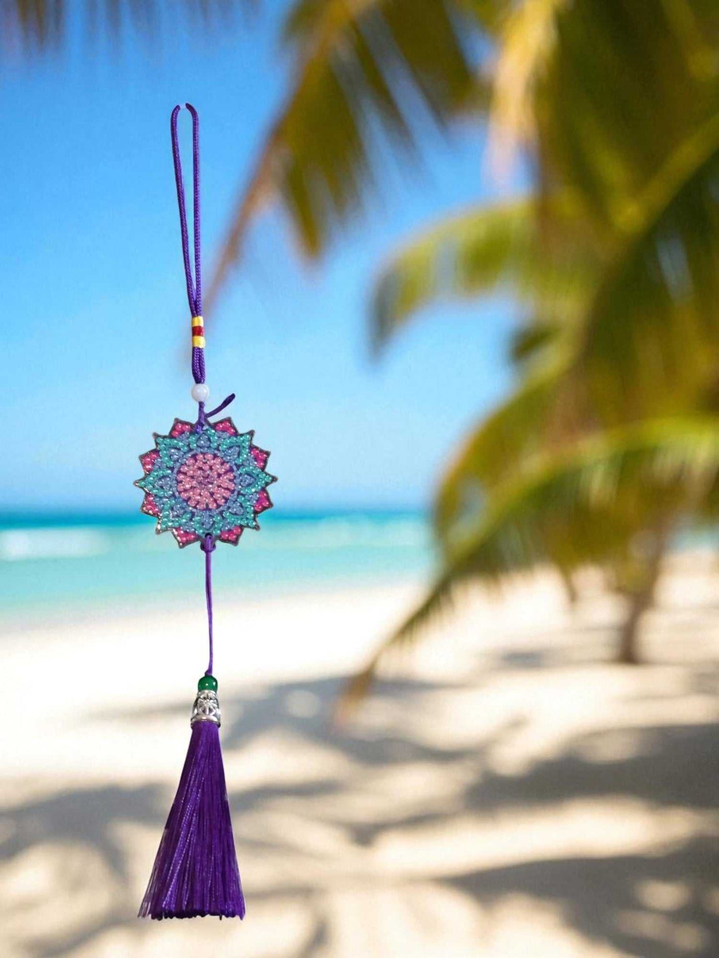 Navy blue colorful design car ornament hanging with beach background