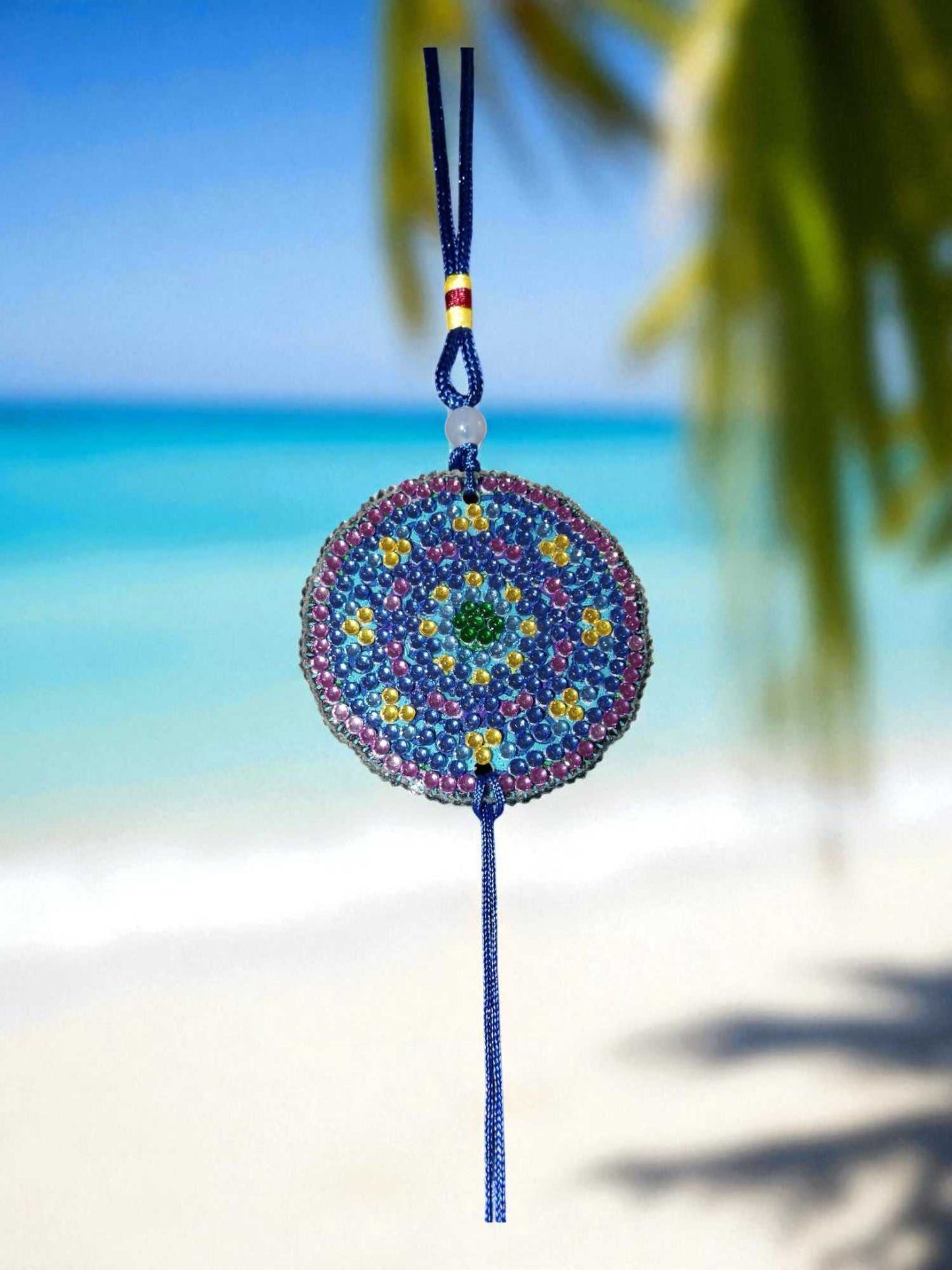 Blue & yellow colorful design car ornament hanging with beach background