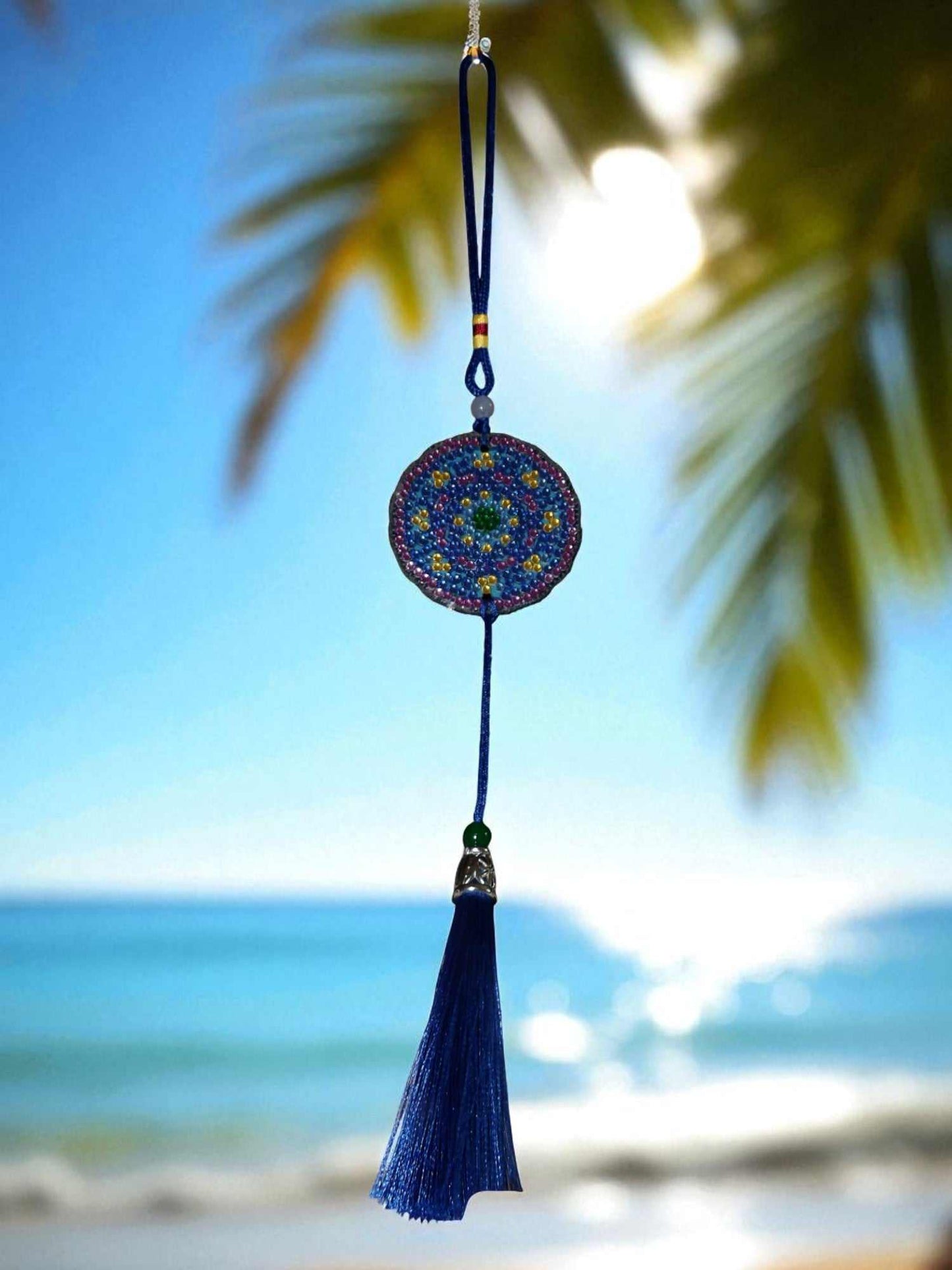 Blue & yellow colorful design car ornament hanging with beach background