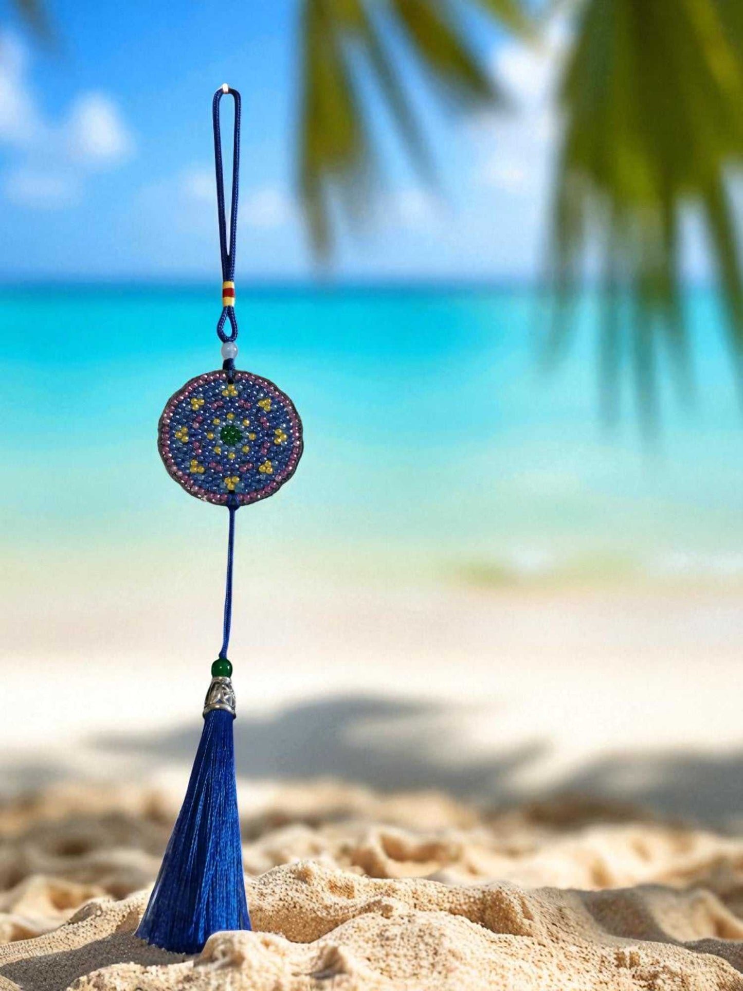 Blue & yellow colorful design car ornament hanging with beach background