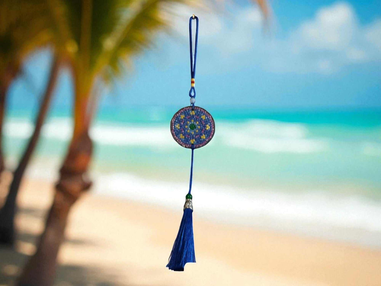 Blue & yellow colorful design car ornament hanging with beach background