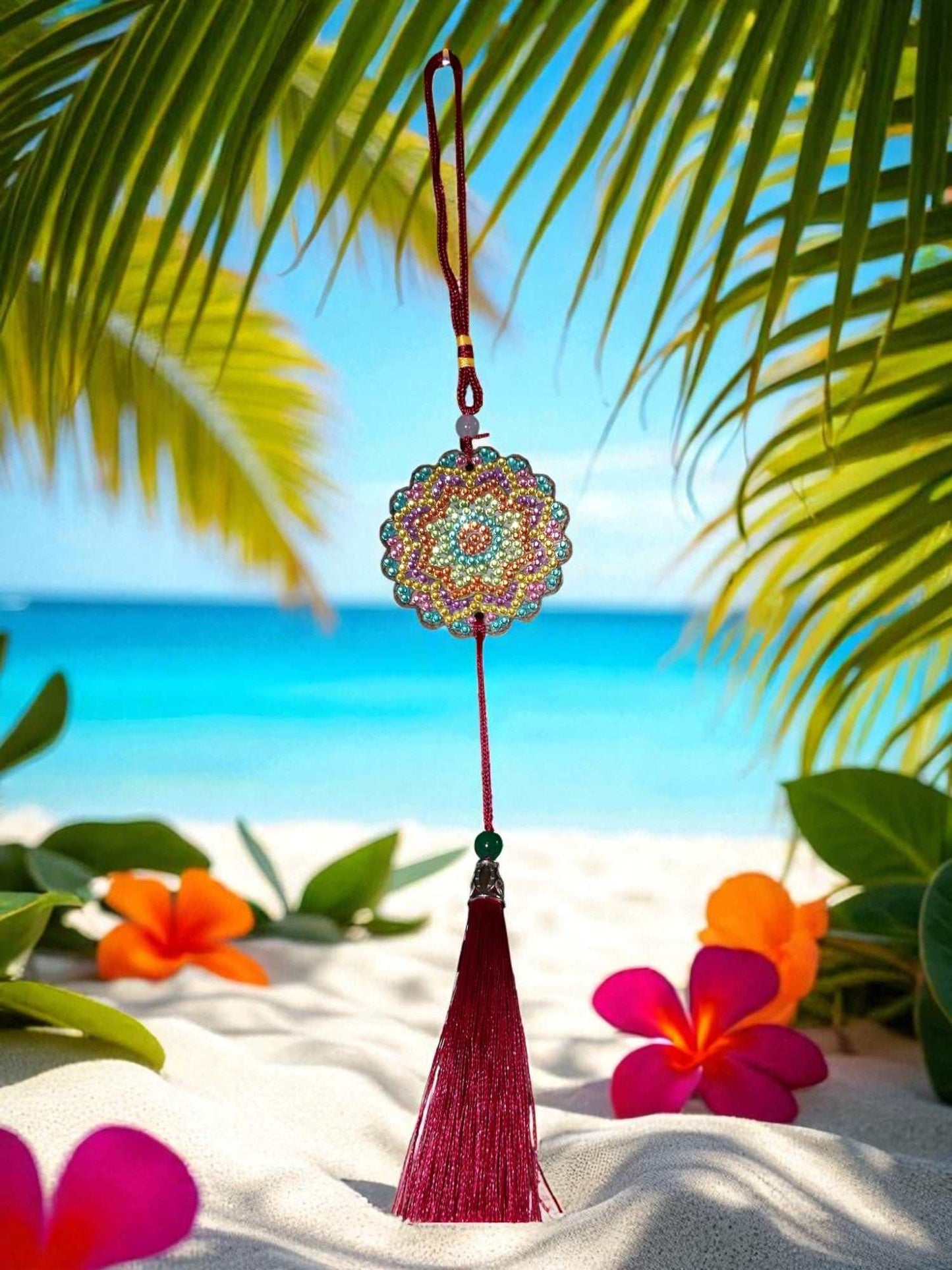 Pink Blue Yellow colorful design car ornament hanging with tassel on beach background