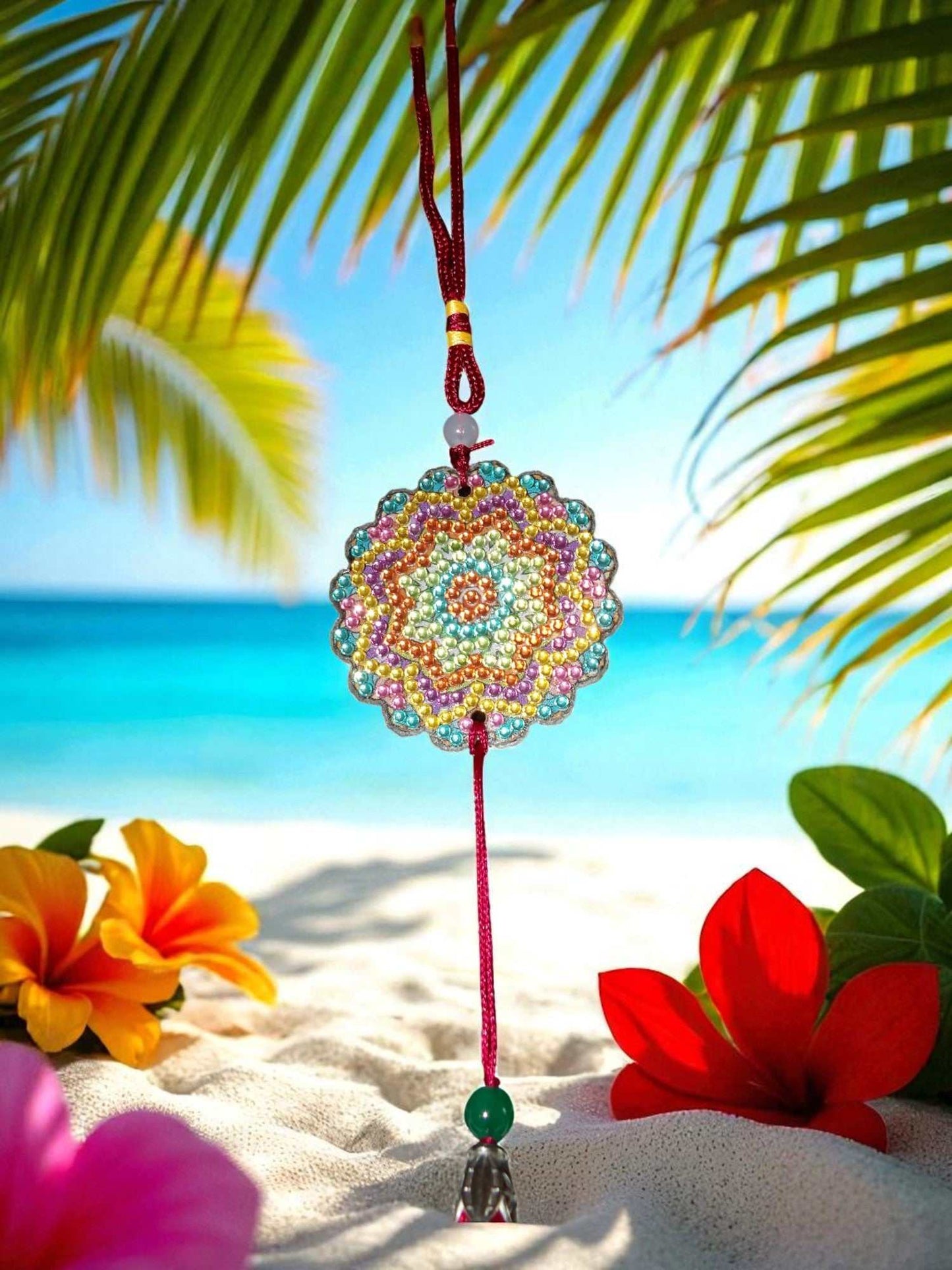 Pink Blue Yellow colorful design car ornament hanging with tassel on beach background