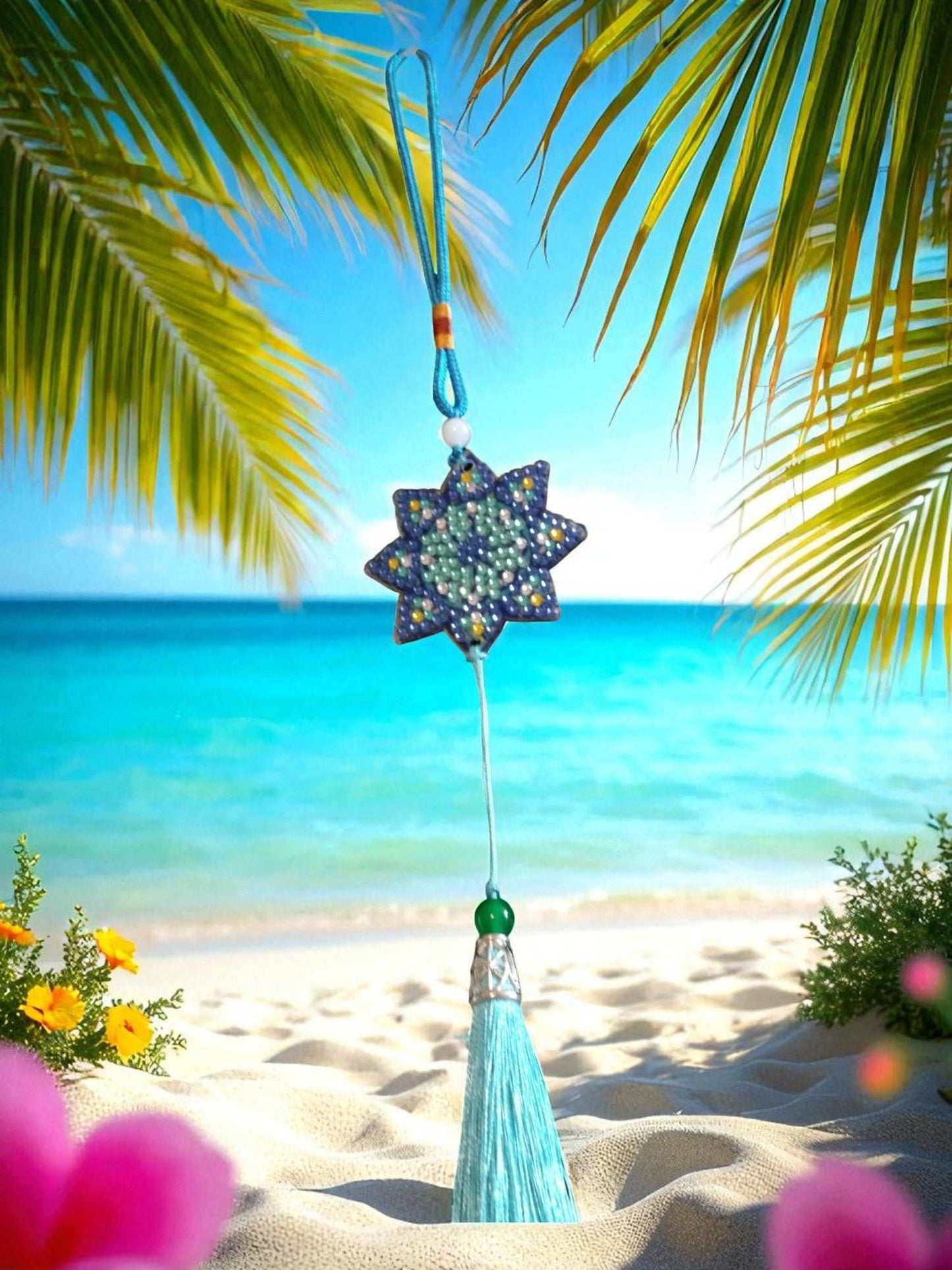 Light Blue Star colorful car ornaments hanging with tassel by beach background