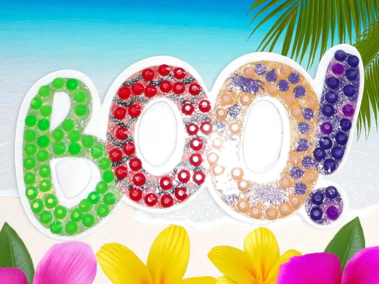 Glow in the dark BOO magnet with colorful bead design on beach background