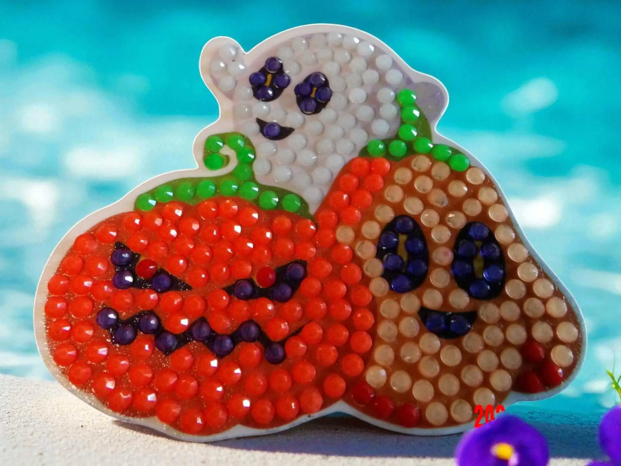 Glow in the dark Halloween family magnet featuring pumpkin, ghost, and smiling face design