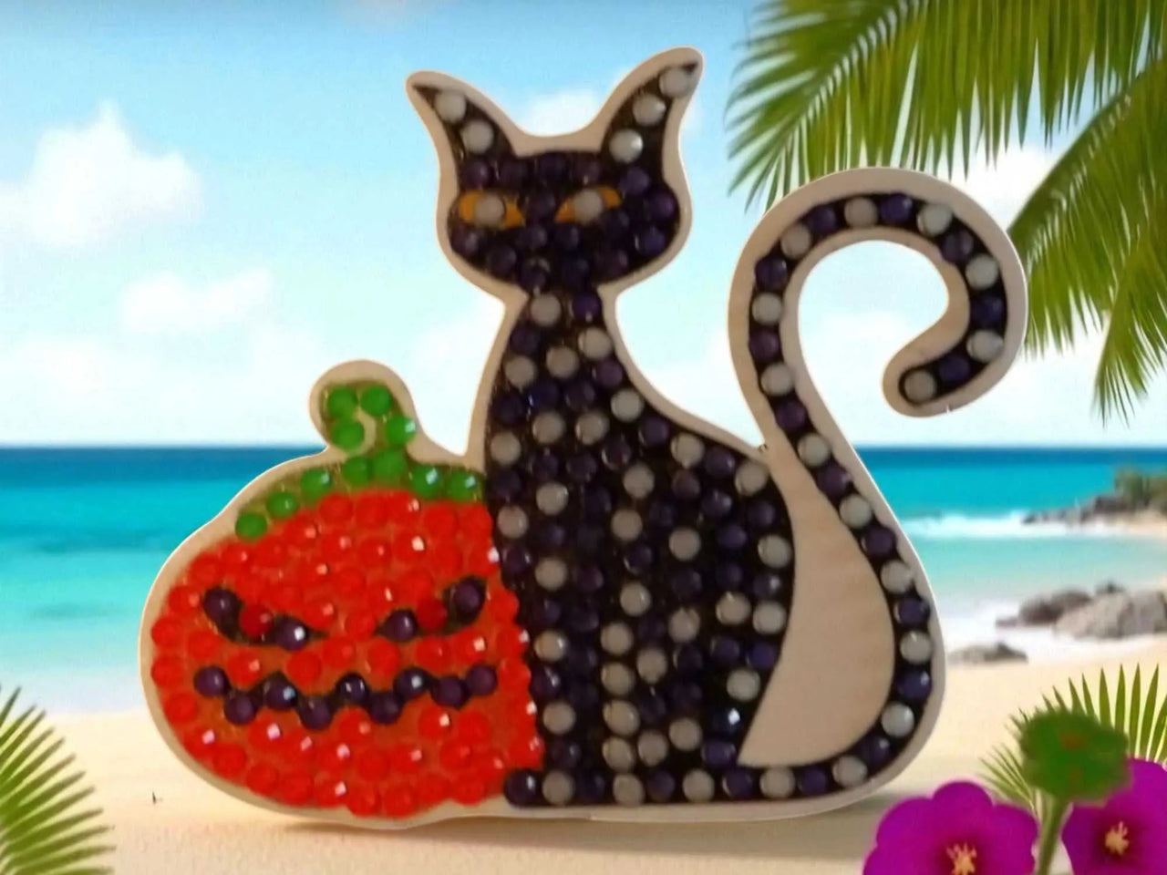 Glow in the dark black cat magnet with pumpkin design on beach background