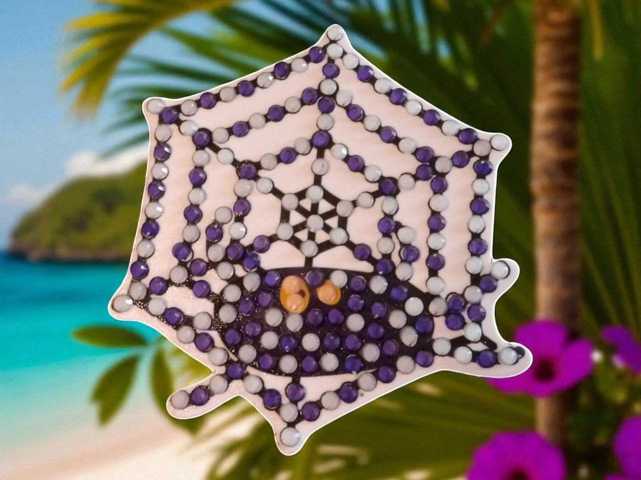 Glow in the dark spider on spider web magnet with purple and white beads