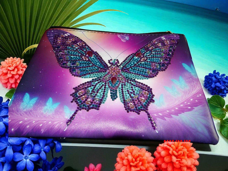 Large purple and blue butterfly hand clutch with beaded butterfly design and spacious interior against a tropical background