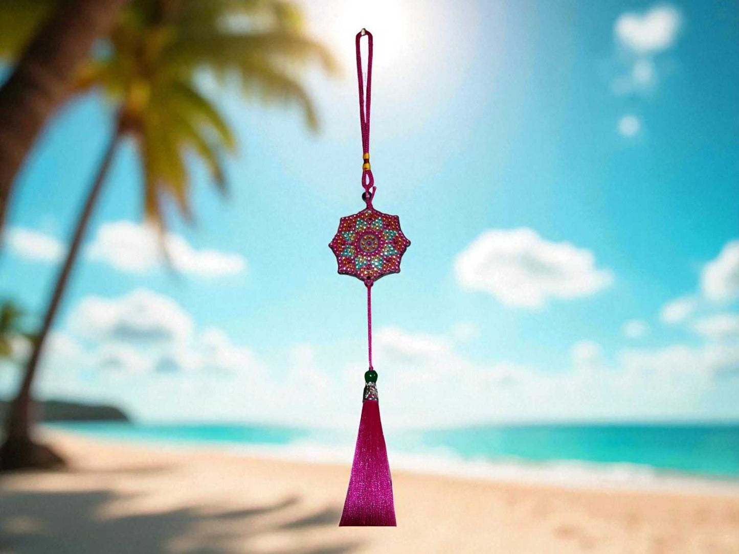 Fushia colorful car ornament hanging with beach background