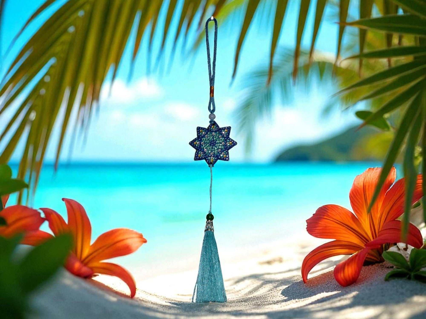 Light Blue Star colorful car ornament hanging with tropical beach background and vibrant flowers