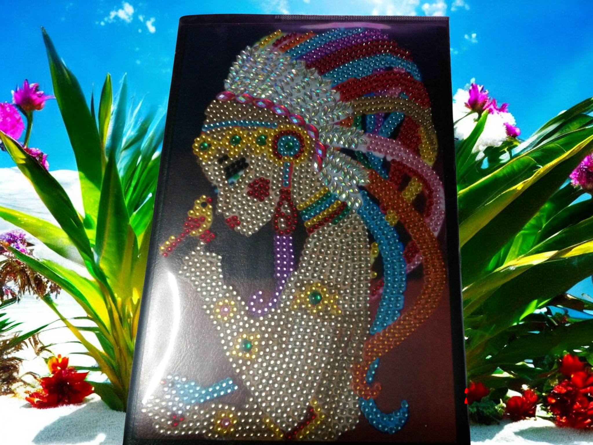 Journal cover featuring intricate beautiful colorful headgear design with beads against vibrant outdoor background